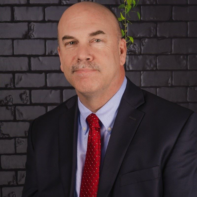 A photographic headshot of a man 